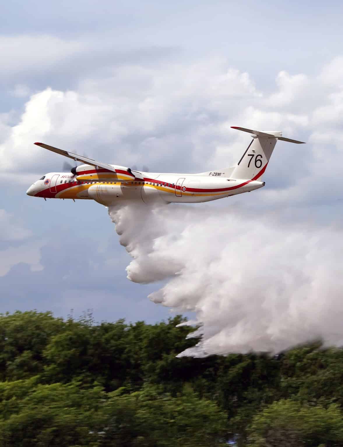 A civil defence Dash 8 dropping water